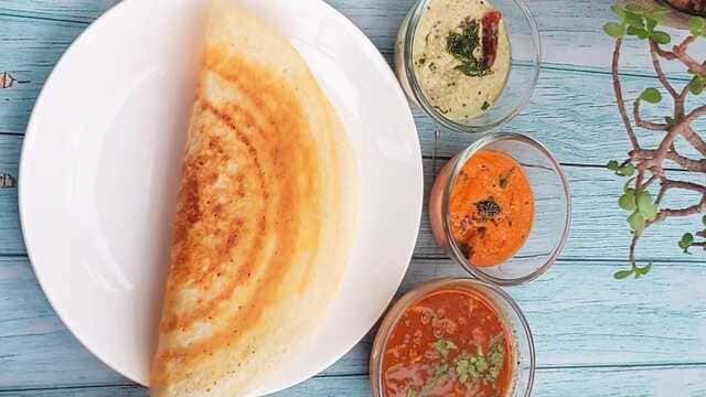 Crispy masala dosa stuffed with spiced potato masala, served with coconut chutney, red chatni and sambar
