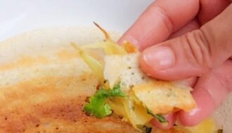 Crispy masala dosa stuffed with spiced potato masala, served with coconut chutney, red chatni and sambar