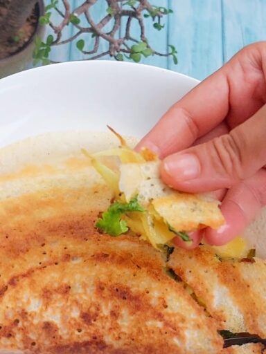 Crispy masala dosa stuffed with spiced potato masala, served with coconut chutney, red chatni and sambar