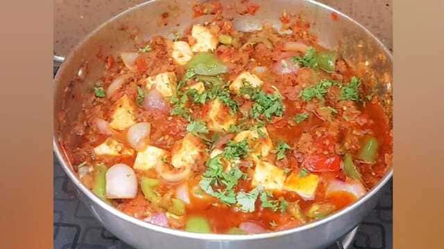 Dry kadai paneer sabzi with roasted vegetables and paneer cubes and coriander leaves