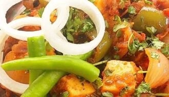 Authentic dhaba style kadai paneer curry with capsicum, onion, and paneer cubes