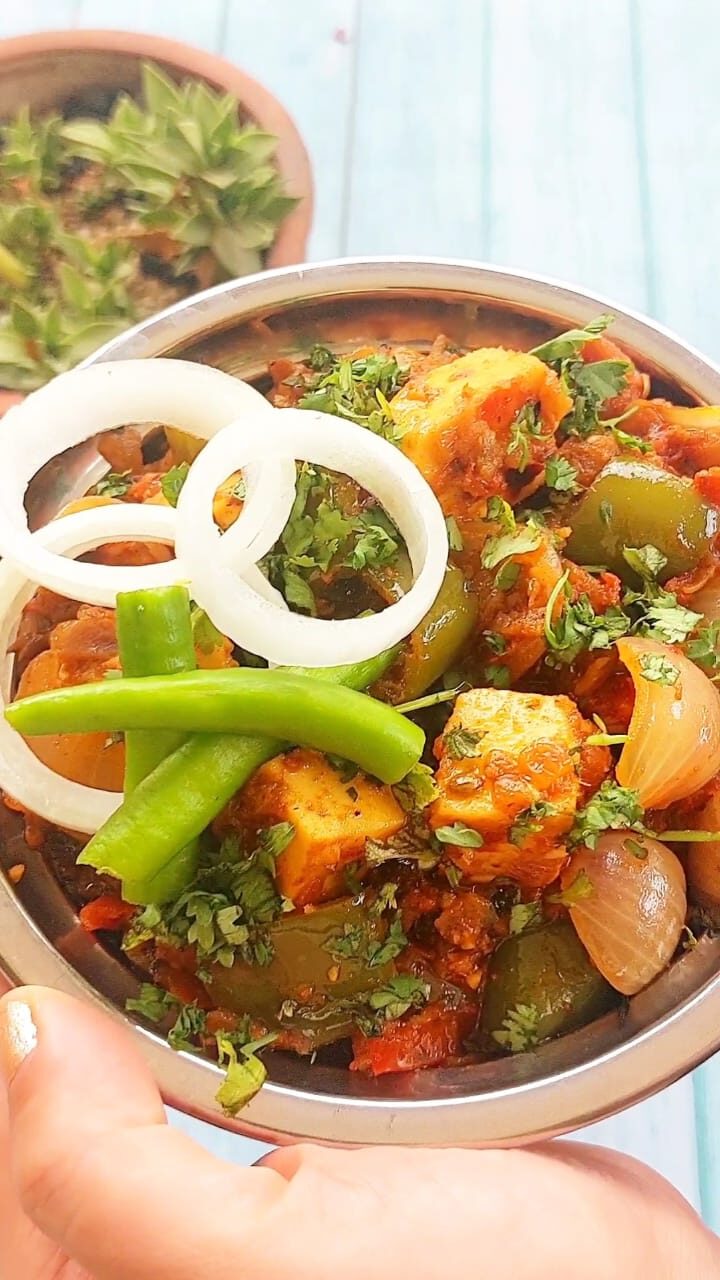 Authentic dhaba style kadai paneer curry with capsicum, onion, and paneer cubes