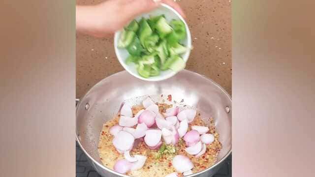 Authentic dhaba style kadai paneer curry with capsicum, onion, and paneer cubes
