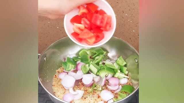 Authentic dhaba style kadai paneer curry with capsicum, onion, and paneer cubes