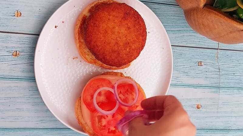 Homemade aloo tikki burger with golden potato patty and fresh veggies