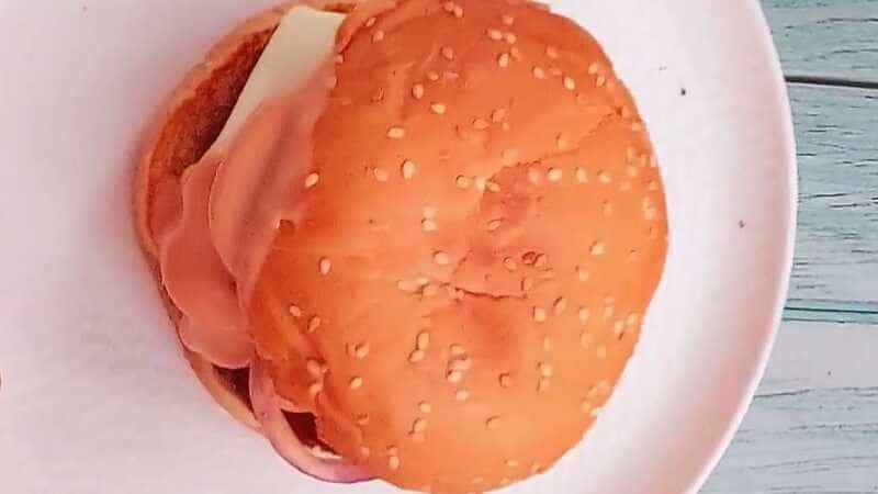 McDonald’s style aloo tikki burger with lettuce and cheese slice
