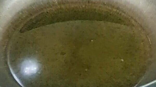 frying onions and spices for aloo masala