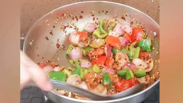 Authentic dhaba style kadai paneer curry with capsicum, onion, and paneer cubes