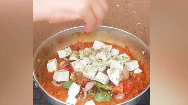 Authentic dhaba style kadai paneer curry with capsicum, onion, and paneer cubes